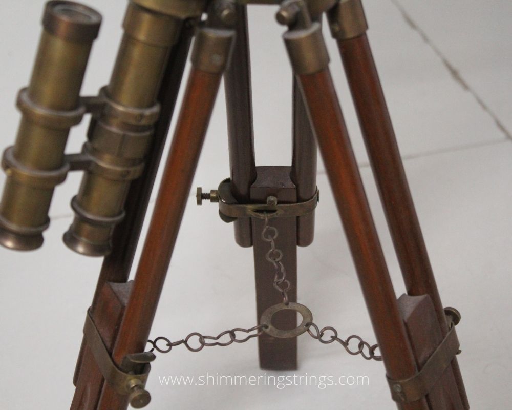 Antique brown brass telescope with tripod